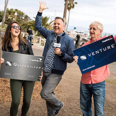 People carrying large Capital One credit cards