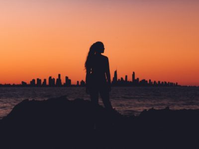 emotional abuse silhouette of girl with sunset and city in bakground