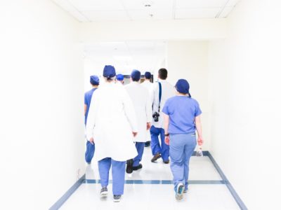 doctors walking down hospital hallway