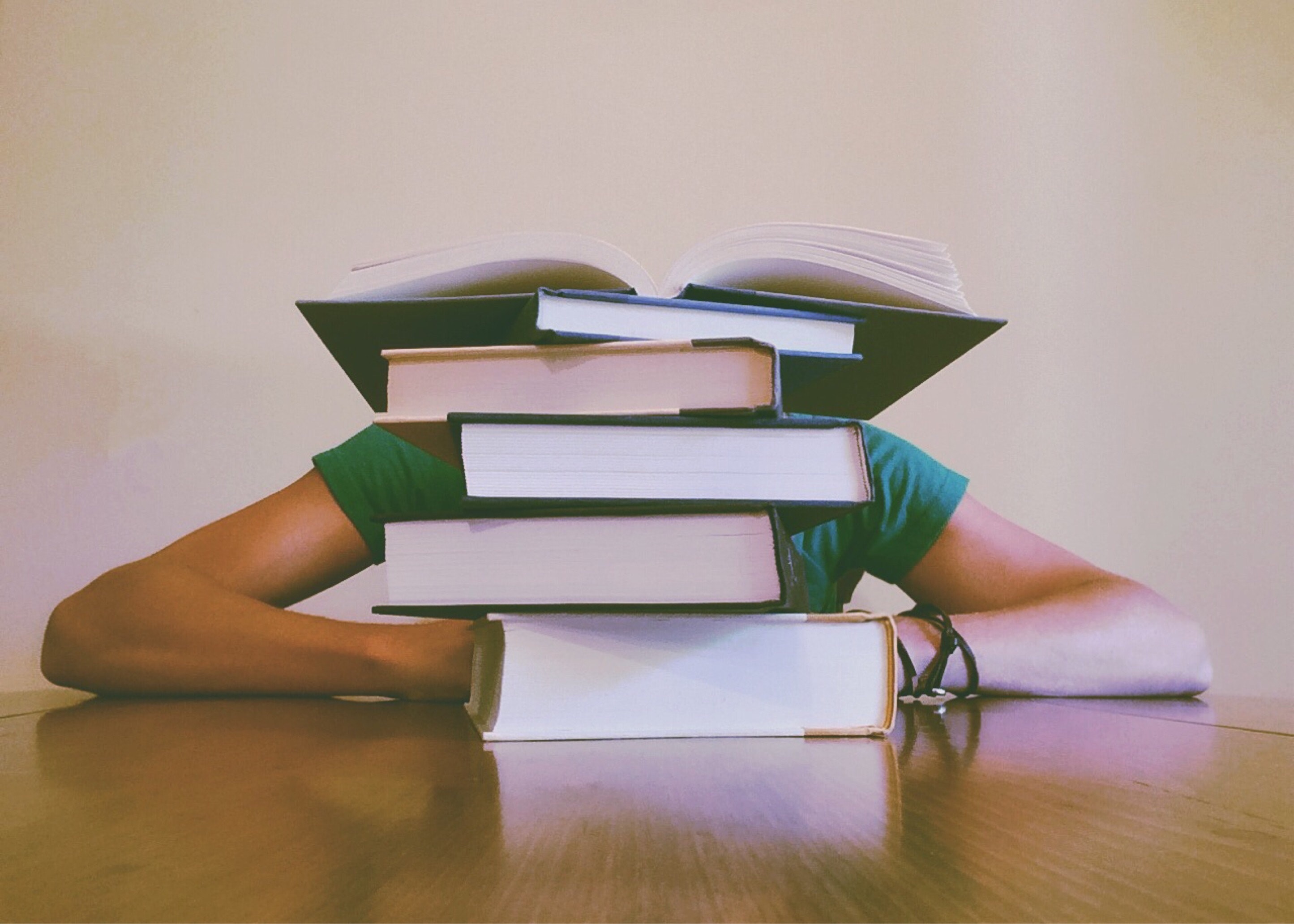 stack of books extracurriculars for med school