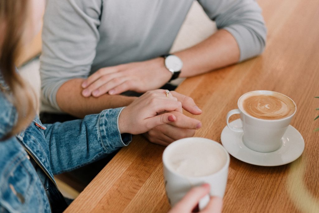 Holding hands with coffee