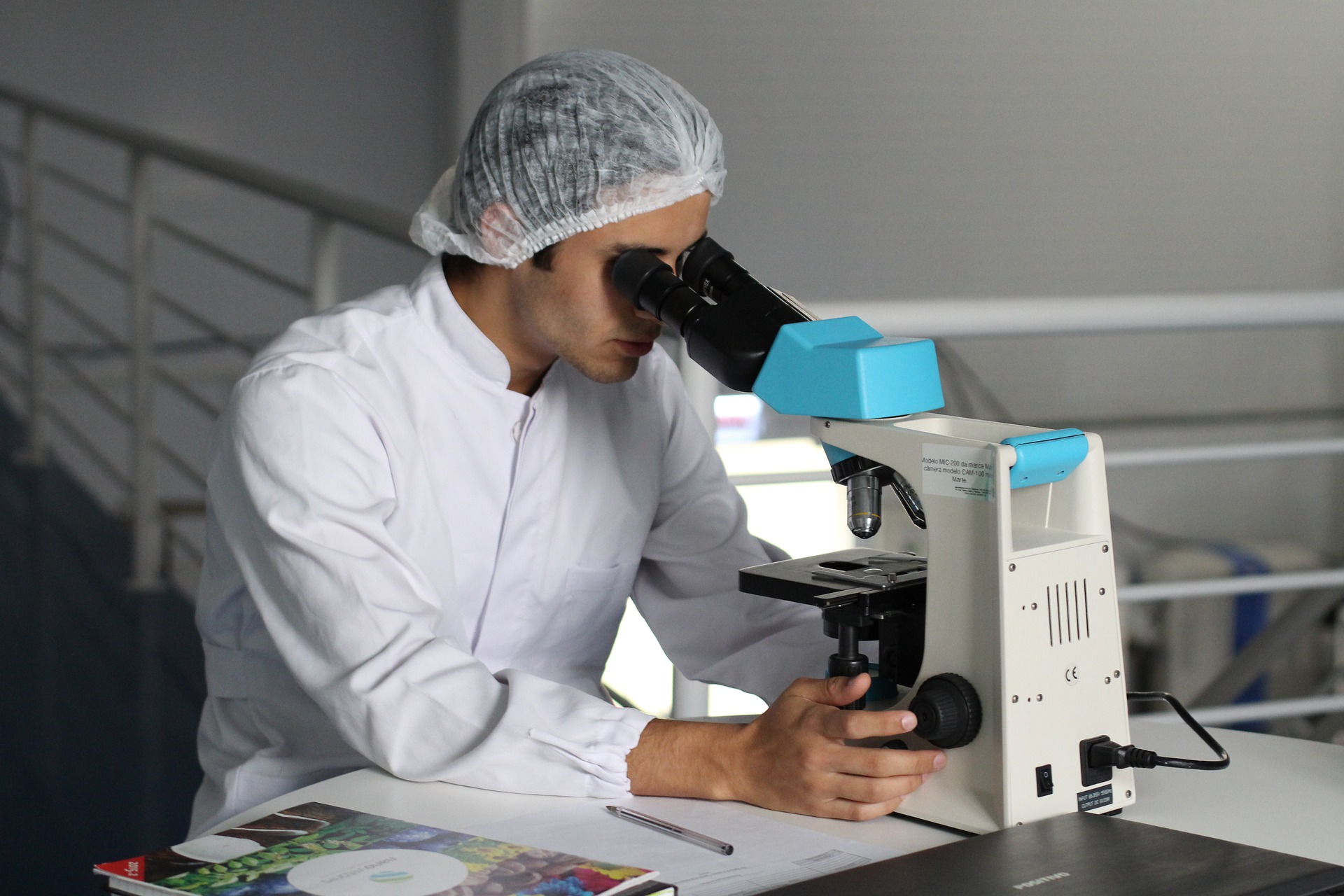 research with microscope extracurriculars for med school