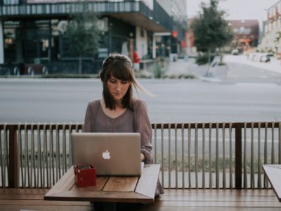 how to become an editor girl on computer at cafe