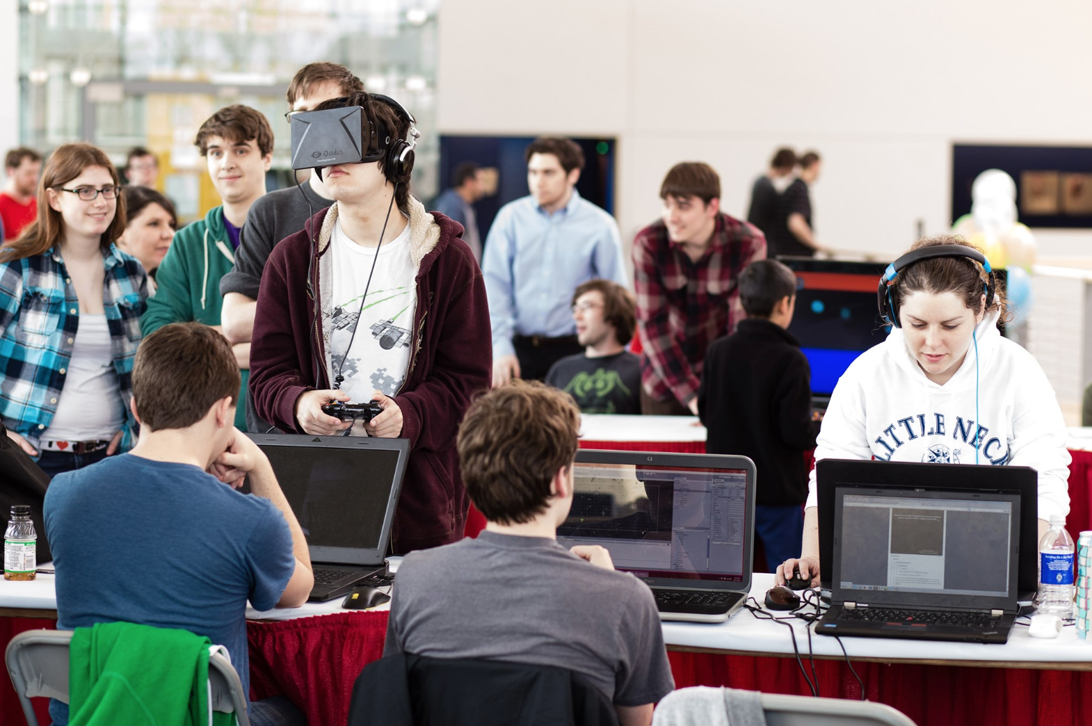 student using a VR system with other students on campus