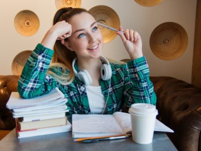 girl with books, thinking