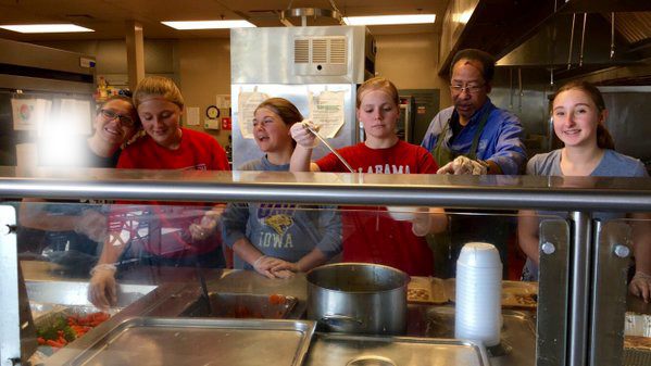 Volunteers serve lunch at Central Iowa Shelters and Services.