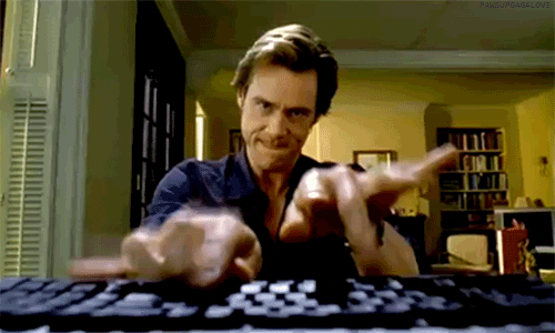 Jim Carrey types frantically at his computer