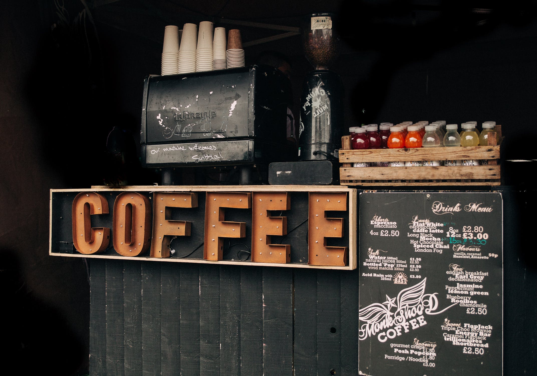 signs saying coffee with a list of flavors