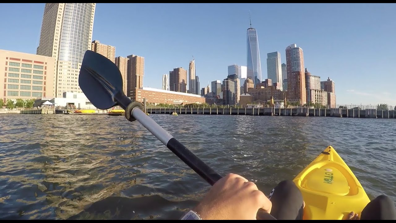 hand paddling on Hudson River overlooking nyc 