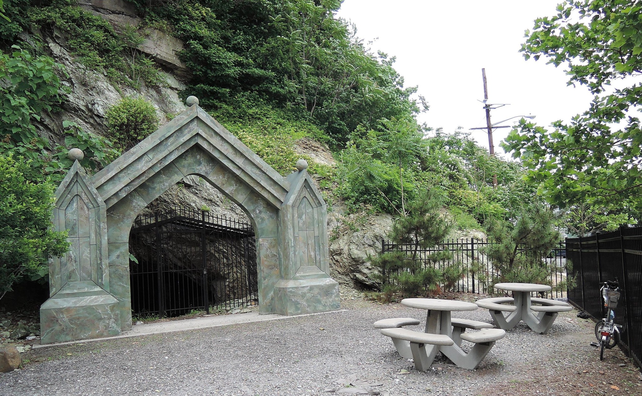sybils cave next to trees and benches