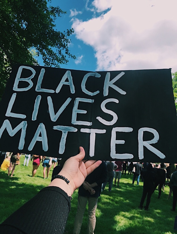 A person holds up a Black Lives Matters sign