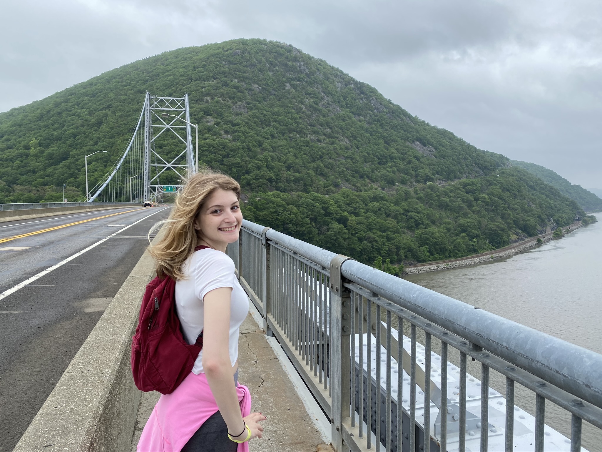 me on the bridge in front of mountains