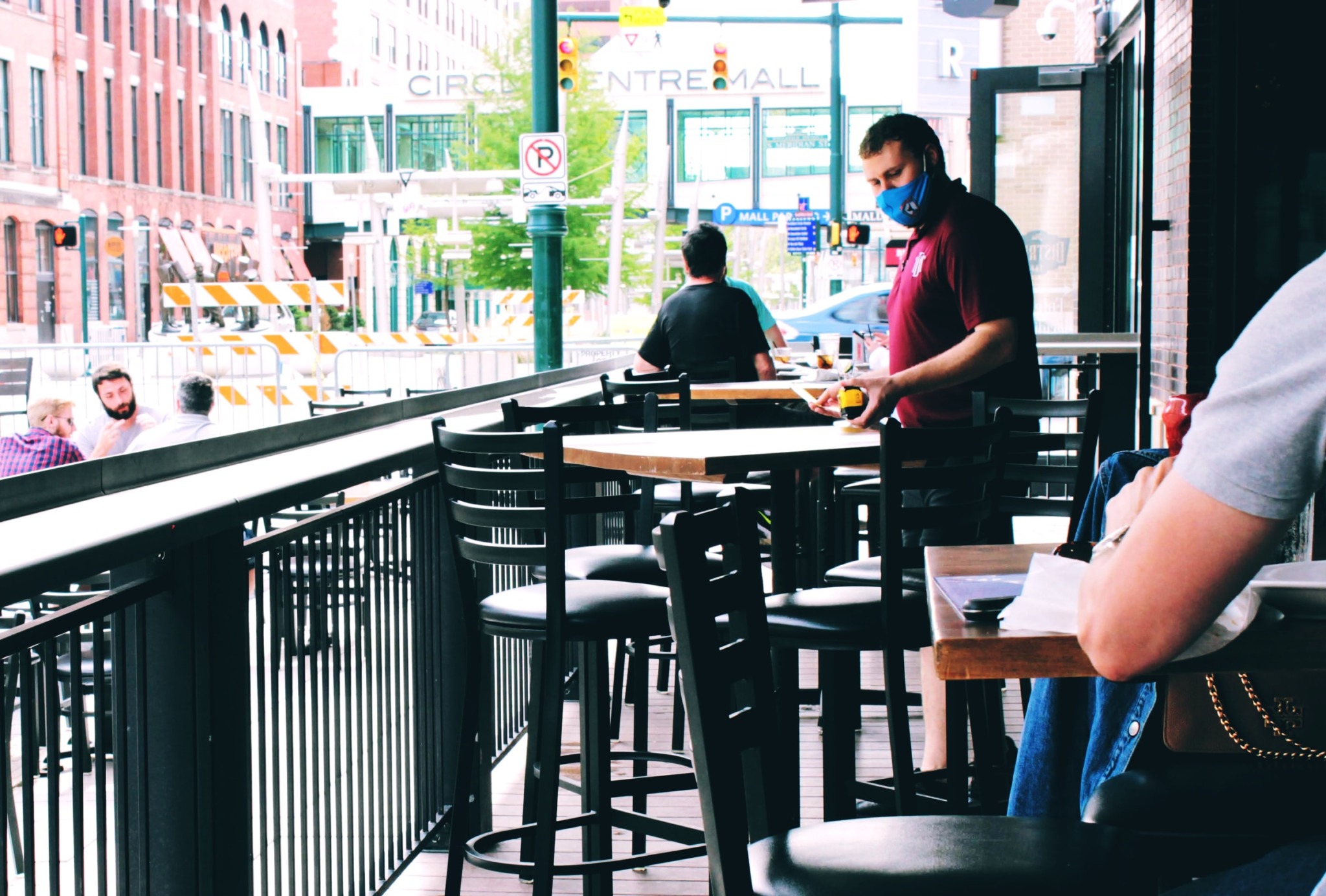 man in a mask at a restaurant