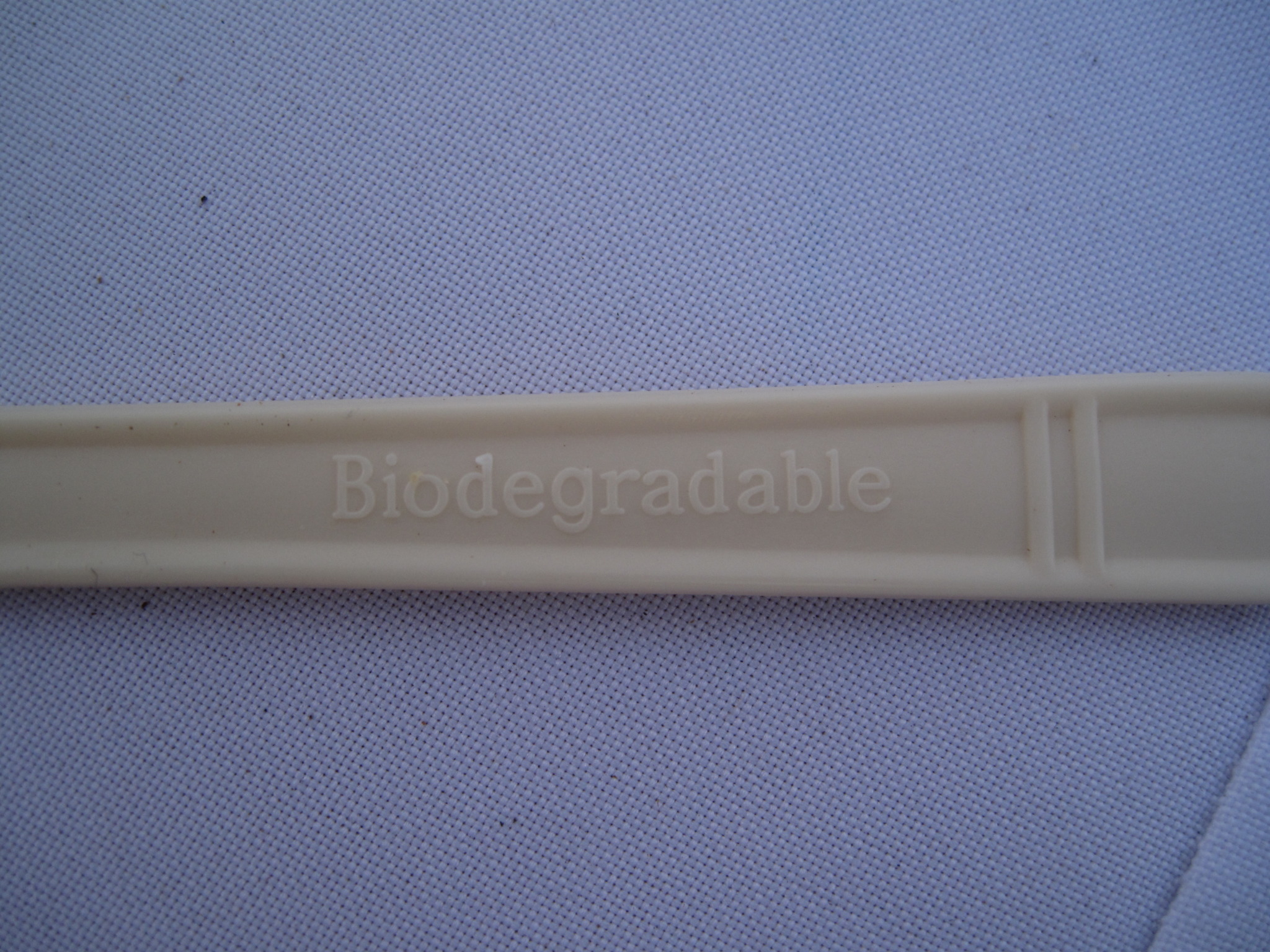 close up of the word biodegradable on the back of a biodegradable utensil