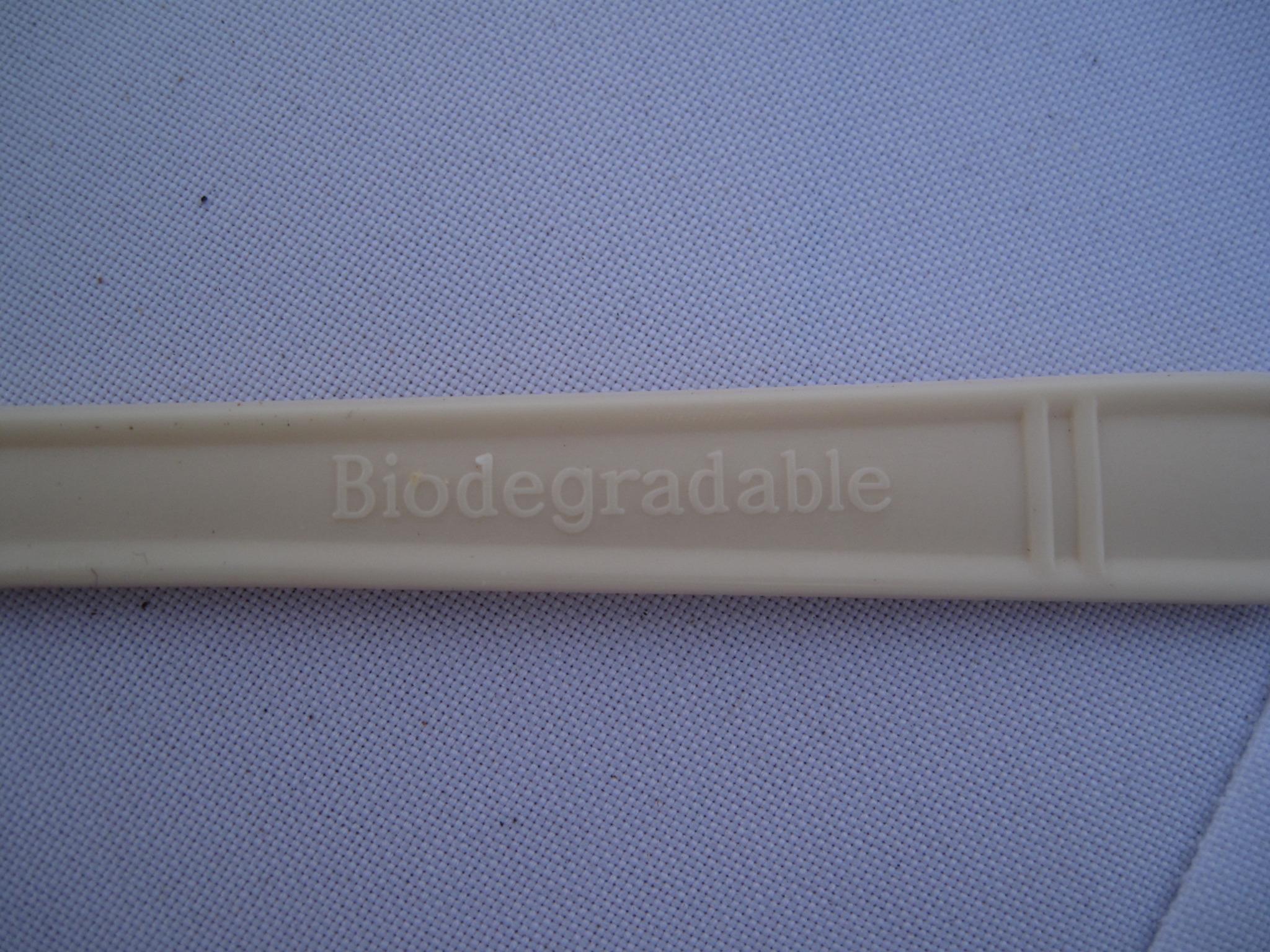 close up of the word biodegradable on the back of a biodegradable utensil