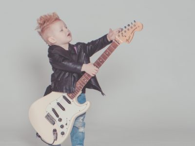 Boy posing with rock guitar