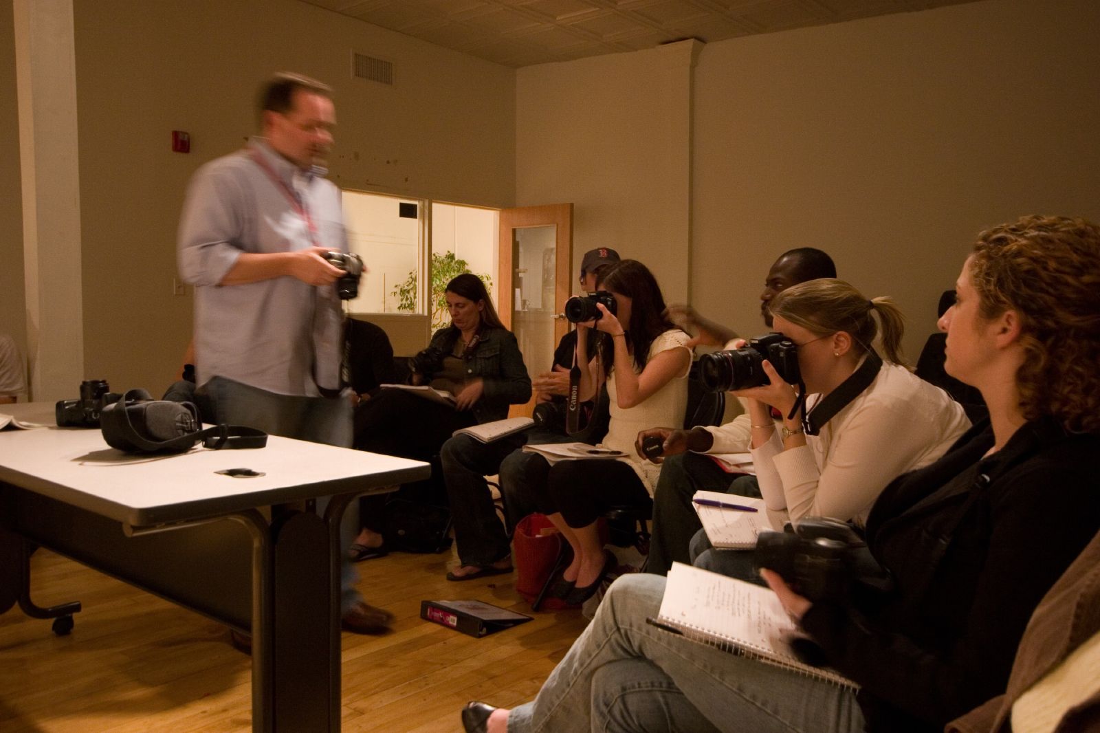 students practice using digital cameras in a Boston University classroom