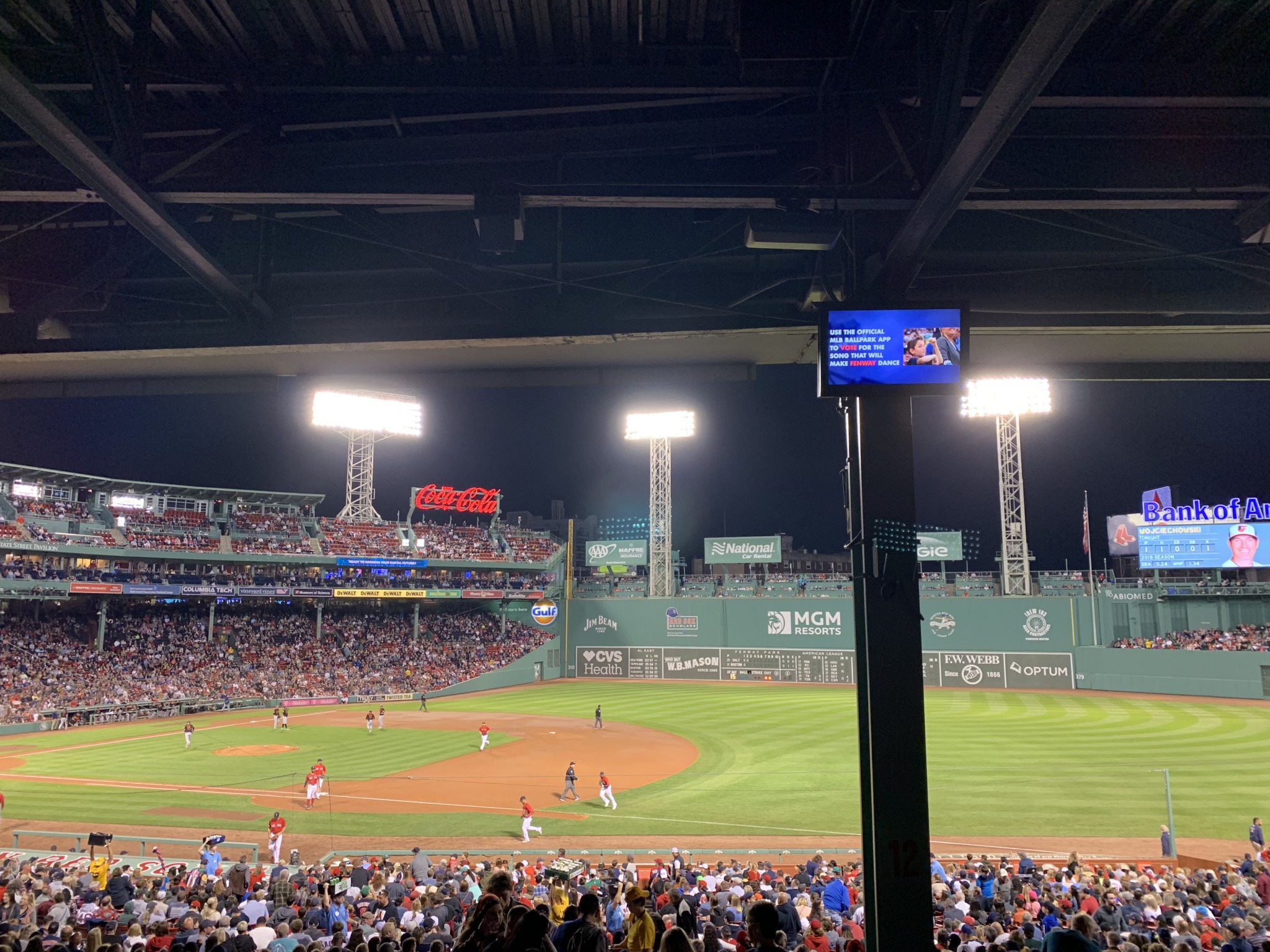 photo of Fenway Stadium from the stands overlooking a Red Sox game