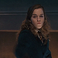 hermione brandishing a wand 