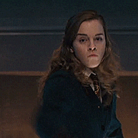 hermione brandishing a wand