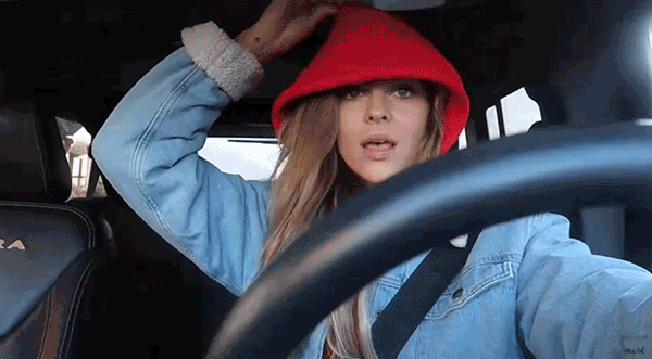 girl vlogging in the car