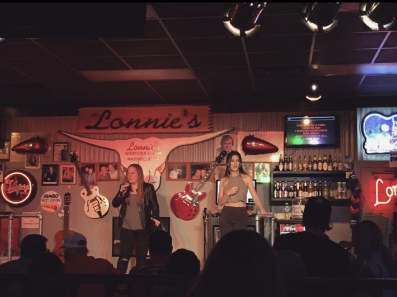 people singing in a karaoke bar