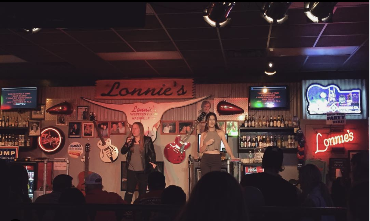 people singing in a karaoke bar