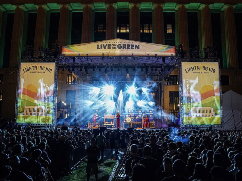 a performer on stage at the Live on the Green music festival