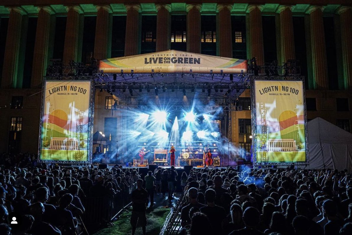 a performer on stage at the Live on the Green music festival