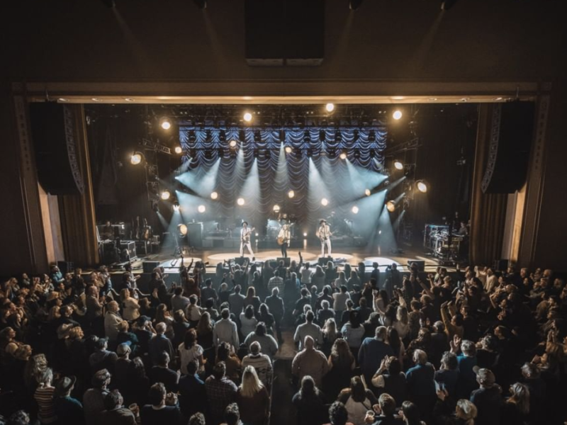 performers on stage at the Ryman Auditorium