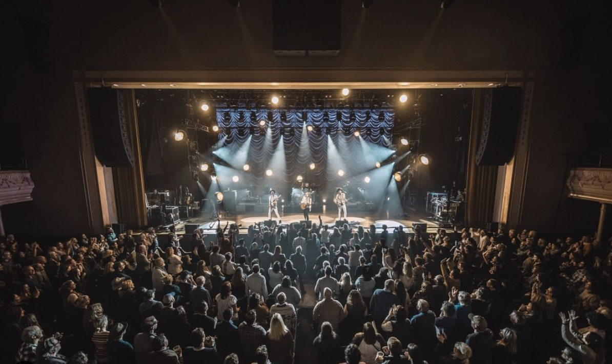 performers on stage at the Ryman Auditorium