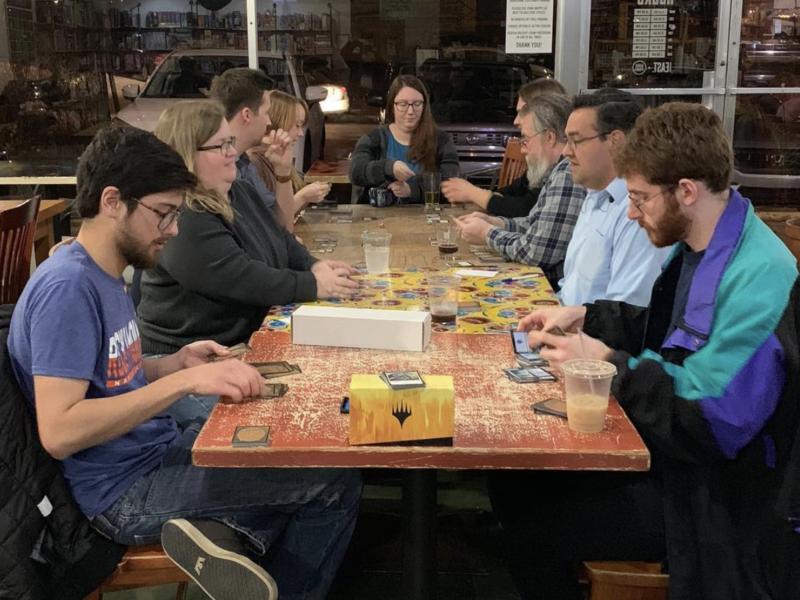 people playing board games at the Game Point Cafe