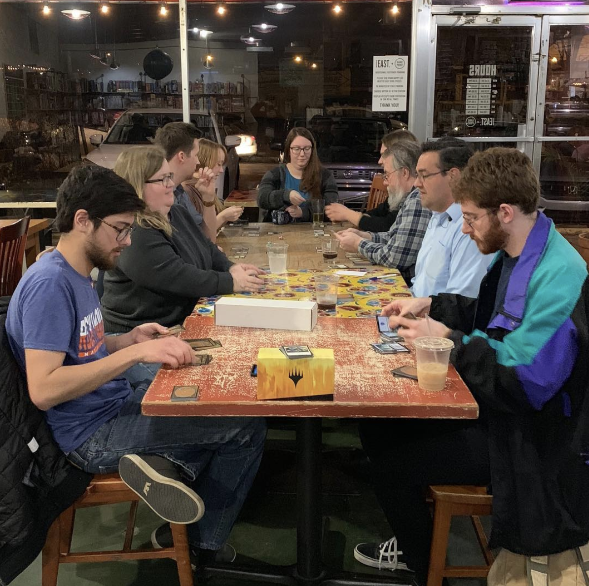 people playing board games at the Game Point Cafe