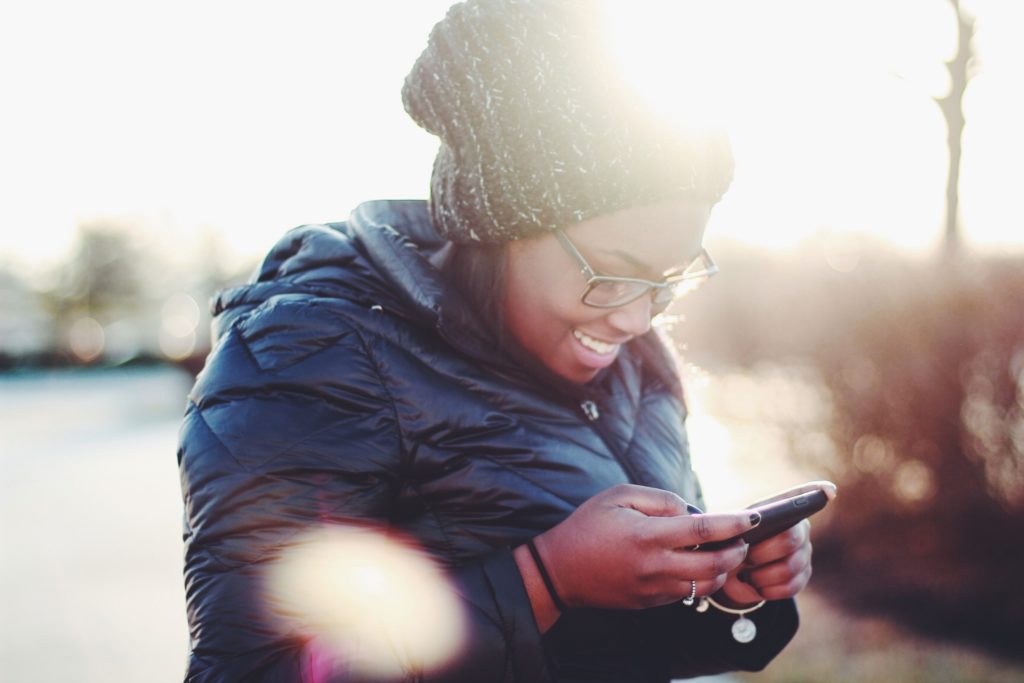 smiling at phone