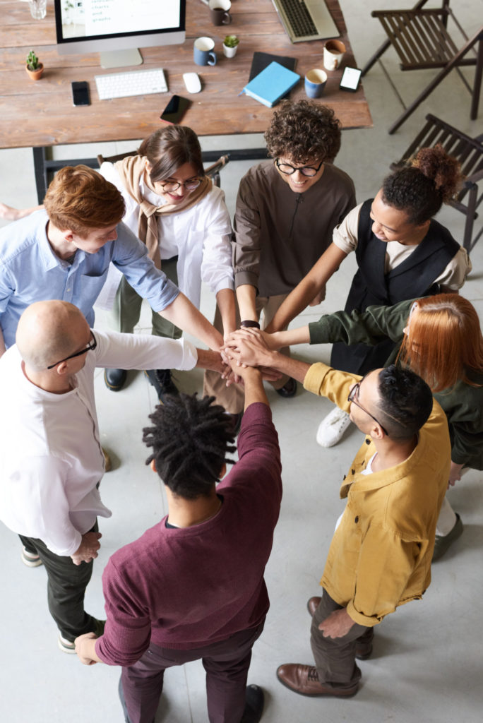 group of people holding hands