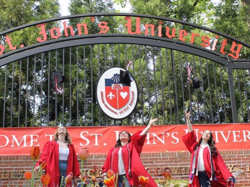 st johns grads throwing caps in the air