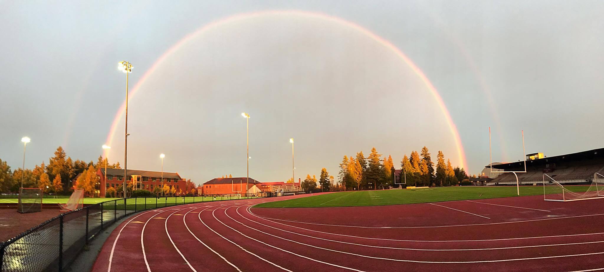 puget sound track field with a rainbow