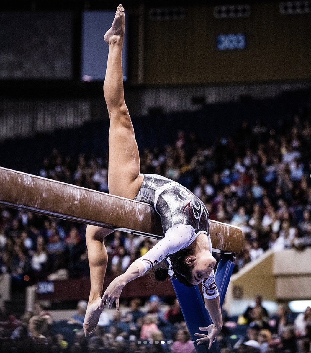 a gymnast on a balance beam