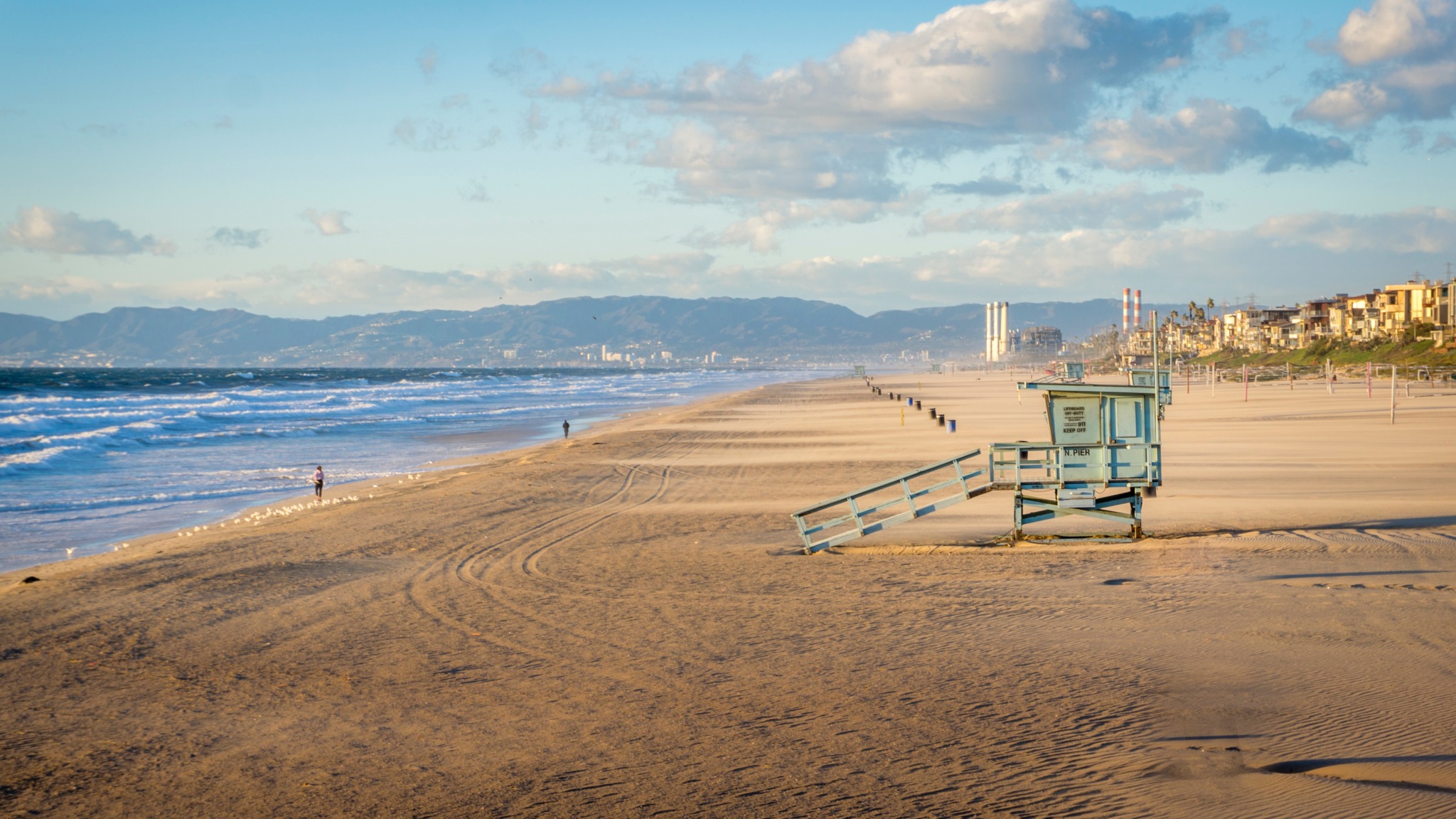 photo of a sandy beach coastline from far away