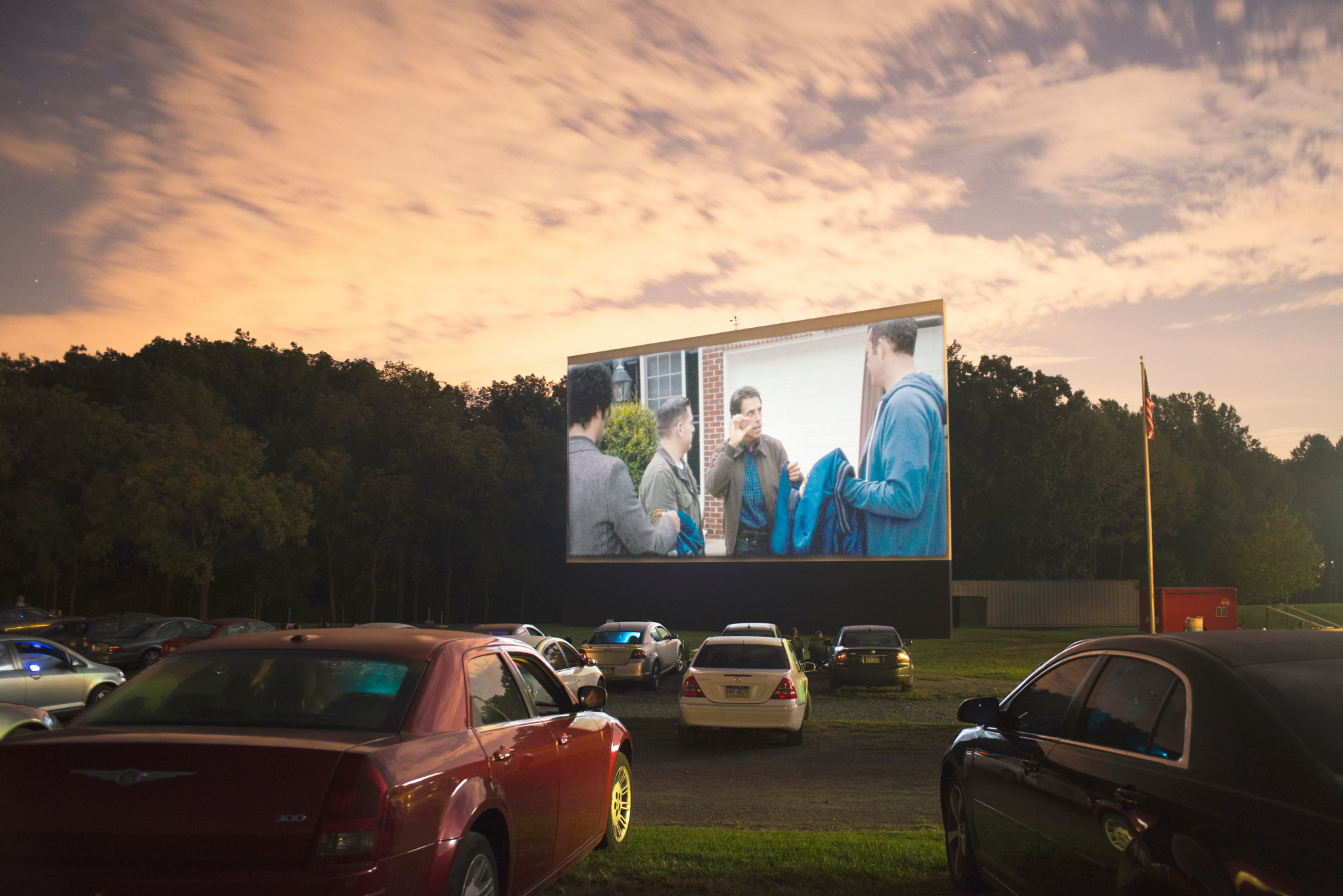 photo of cars parked at a drive in