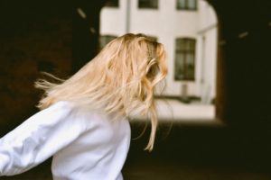 blonde girl with hair on her face