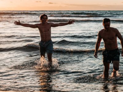 young men at the beach