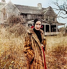 Edie Beale in front of her house