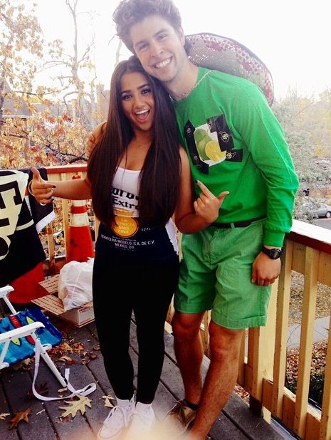 couple in green and a corona logo