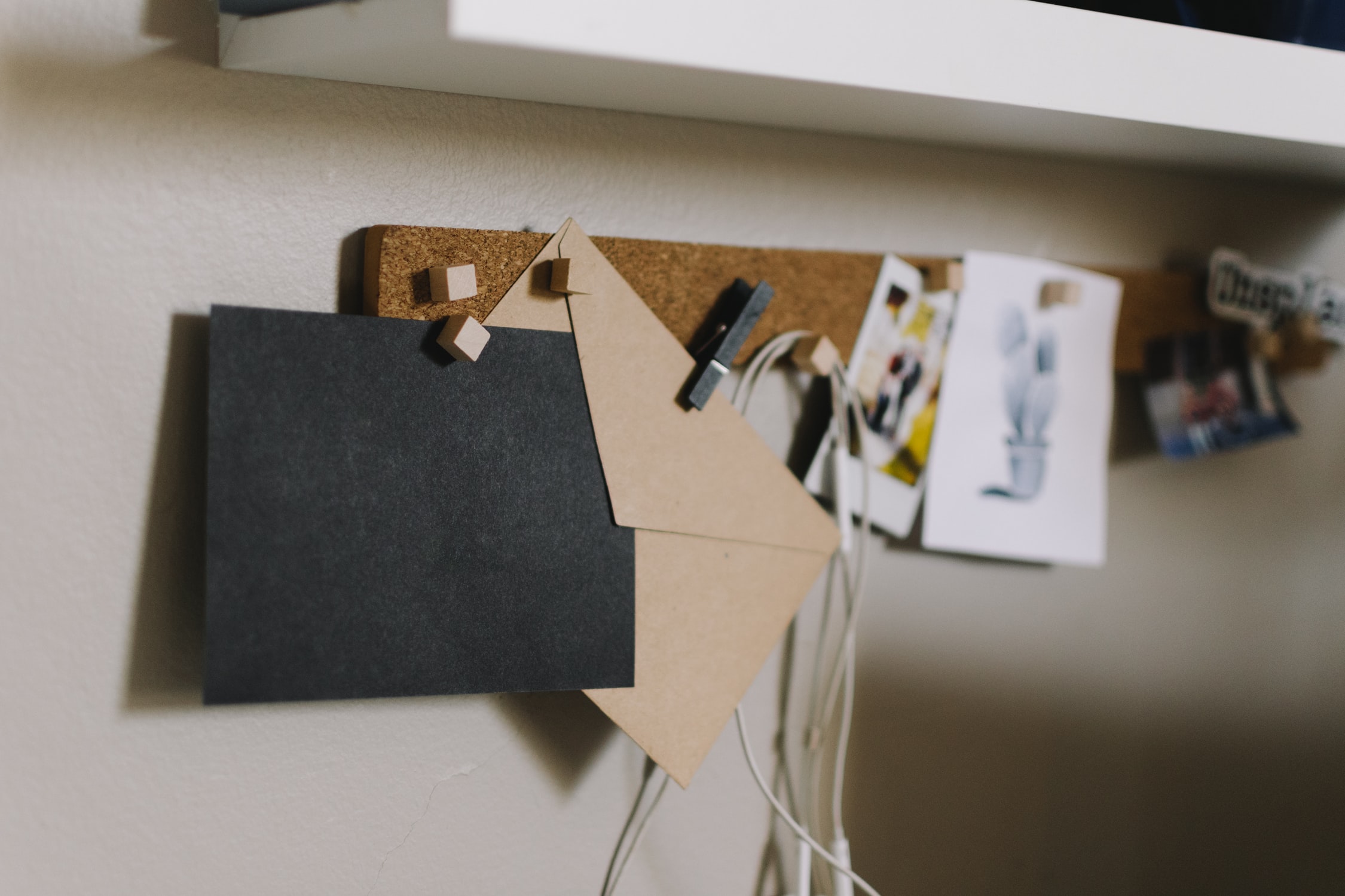 cork board holding notes and pins