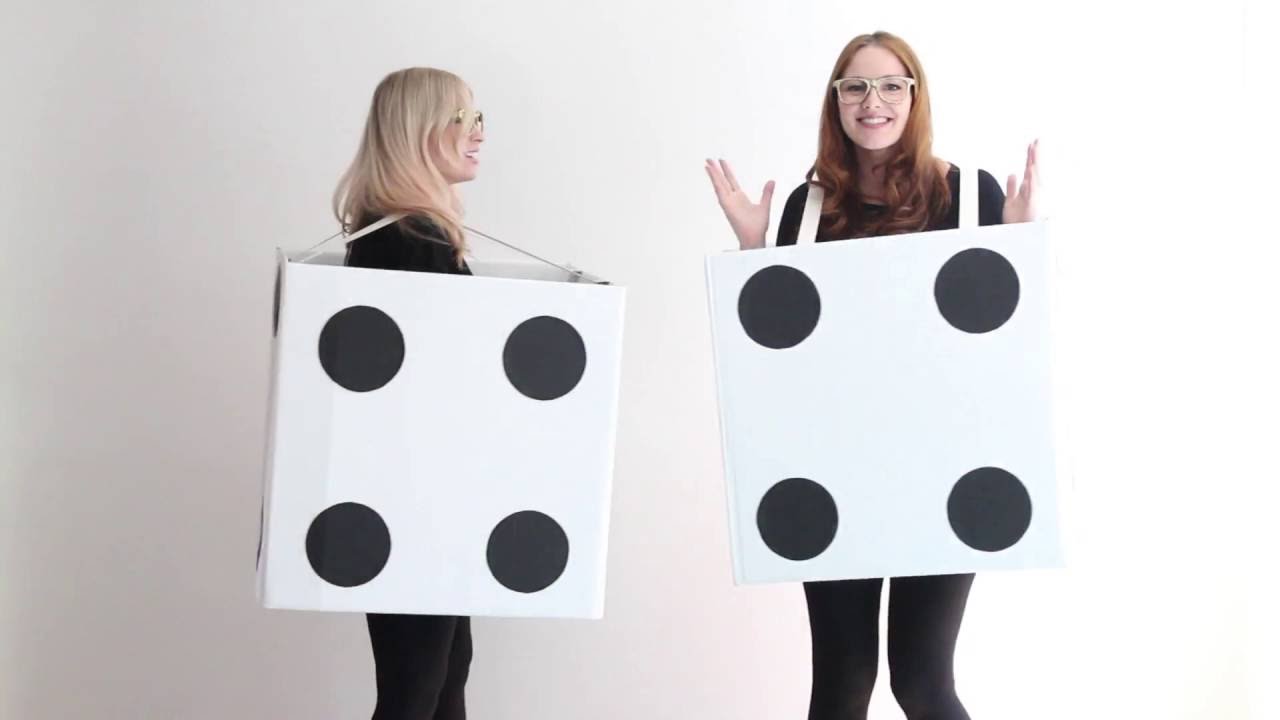 two girls in white boxes with black circles like dice