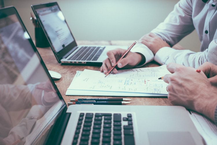 Two people working at a desk