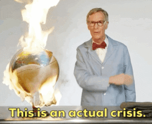 bill nye the science guy standing next to a burning globe