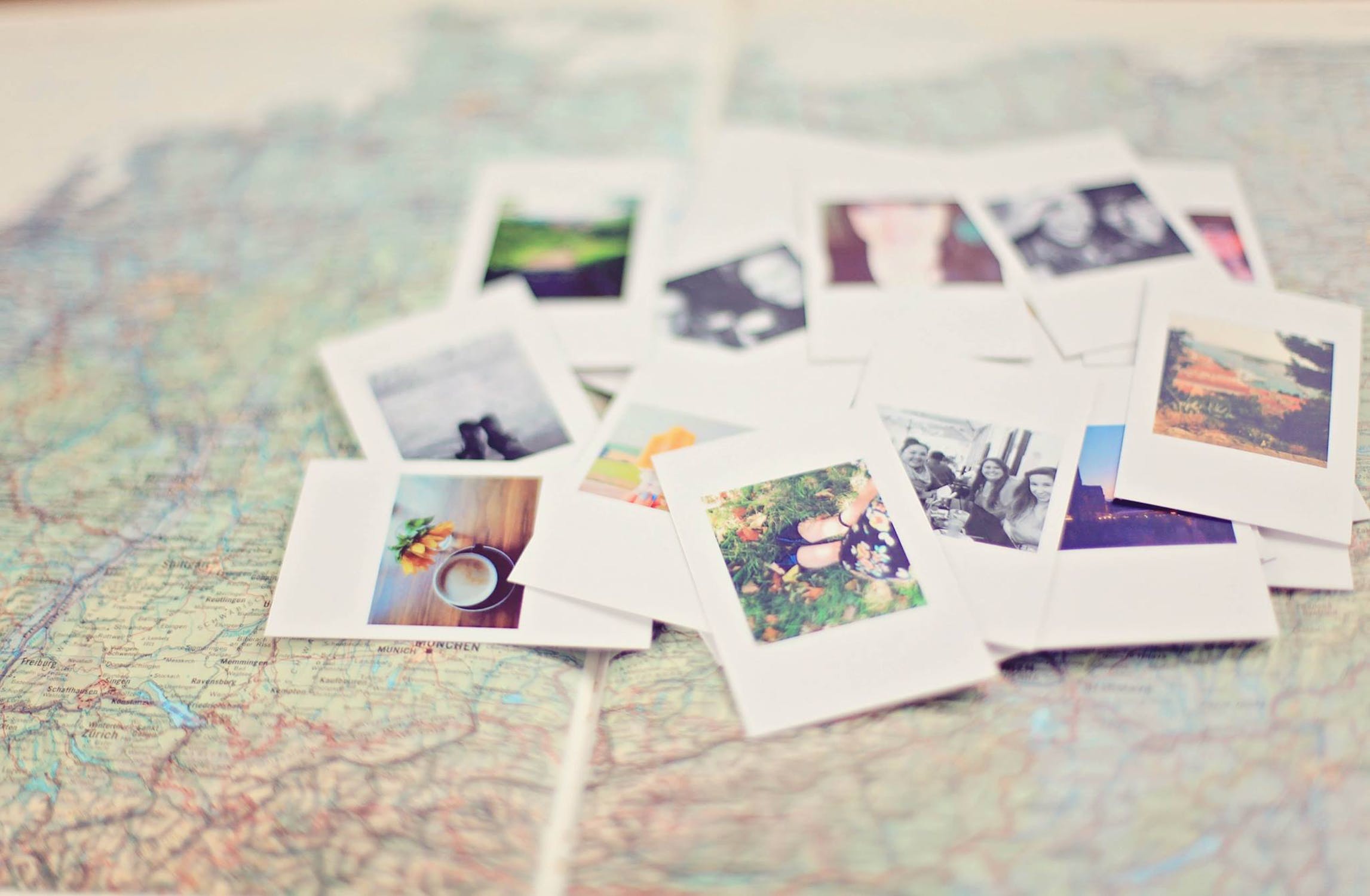 world map with polaroids