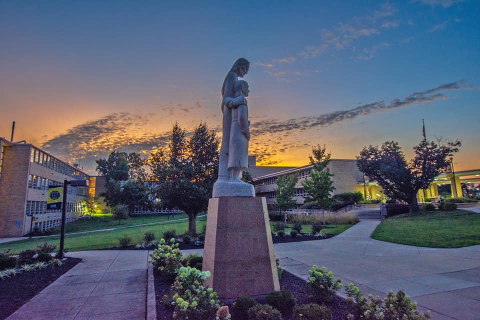 sunset behind statue